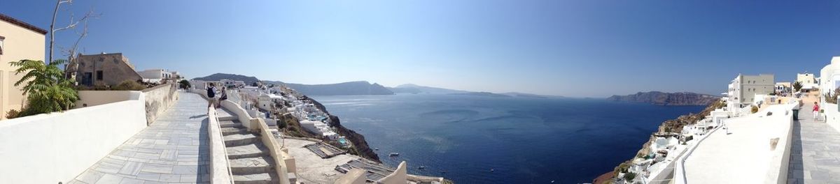 Panoramic shot of built structures against clear blue sky