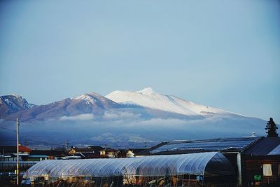 Scenic view of snow covered mountains against sky