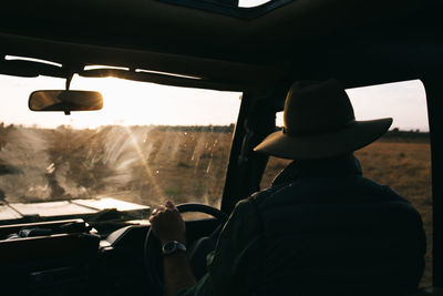 Rear view of man in car