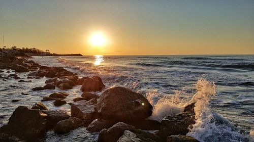 Scenic view of sea against sky during sunset