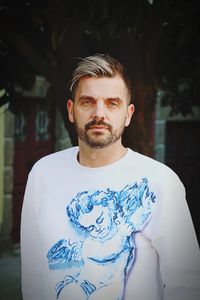 Portrait of young man standing outdoors