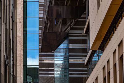 Low angle view of modern buildings against sky