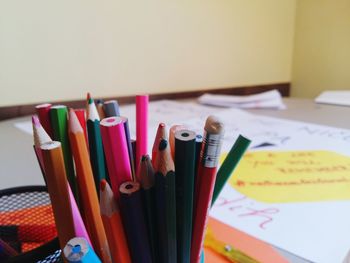 Close-up of colored pencils on table