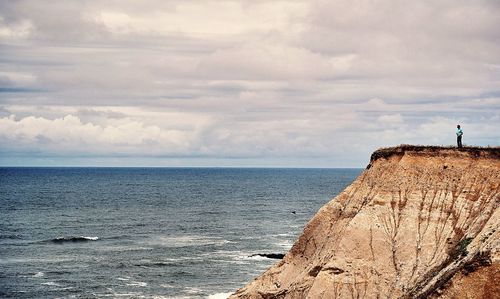 Scenic view of sea against cloudy sky