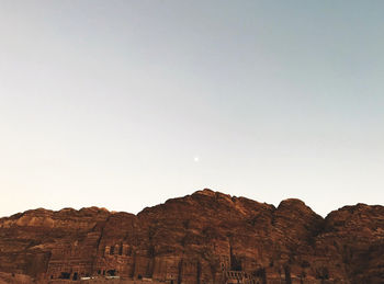 Low angle view of rock formations against sky