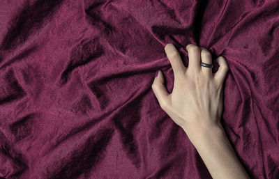 Directly above shot of woman relaxing on bed