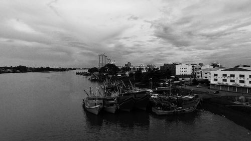 Boats moored at harbor