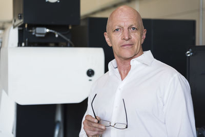 Portrait of confident man in factory