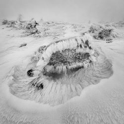 High angle view  on snow covered land in  vladeasa mountains 