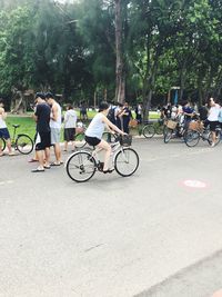 Man riding bicycle on road