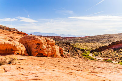 Rock formations on landscape against sky