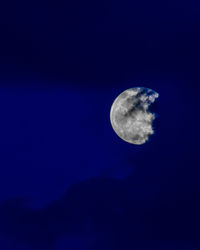 Low angle view of moon in sky at night