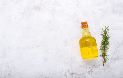 Yellow bottles on white wall