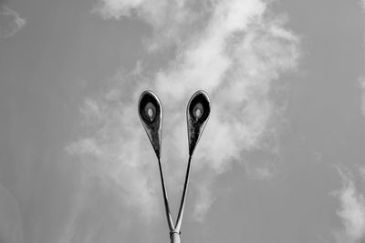 Low angle view of street lights against sky