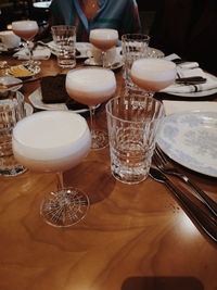 Close-up of wine glasses on table in restaurant