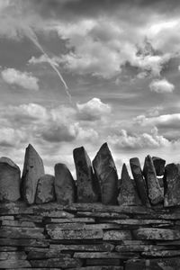 Low angle view of rocks against sky