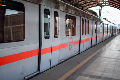 Delhi metro train arriving at jhandewalan metro station in new delhi, india,asia, public metro train