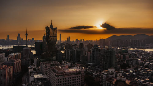 Cityscape against sky during sunset