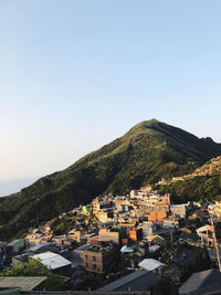 High angle view of townscape against mountain