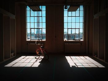 Bicycle parked in darkroom