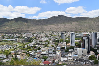 High angle view of buildings in city against sky