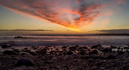 Scenic view of sea at sunset