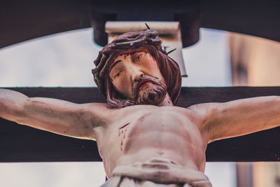 Low angle view of jesus christ crucified statue