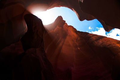 Low angle view of antelope canyon against blue sky