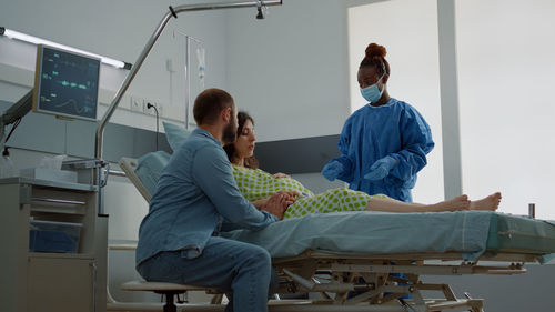 Doctor examining patient in clinic