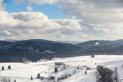 Scenic view of snow covered mountains against sky