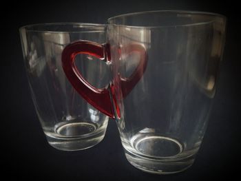 Close-up of wineglass against black background