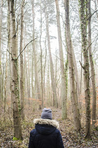 Rear view of person in forest