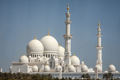 Low angle view of grand mosque against clear sky