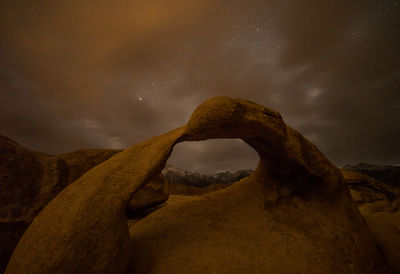 Low angle view of rock formation against sky