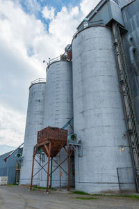 Low angle view of factory against sky