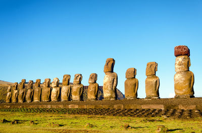 Ancient statues against clear sky