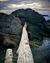 Rocks on mountain against sky