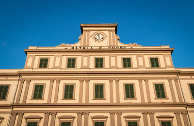 Low angle view of building against blue sky