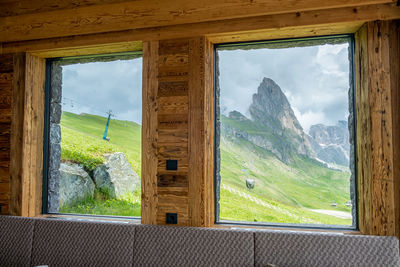 Scenic view of mountains seen through window