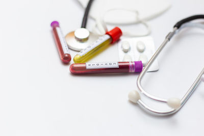 High angle view of objects on table against white background