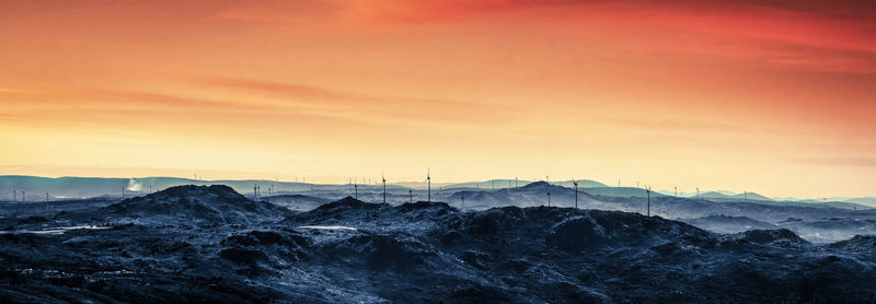 Scenic view of mountains against sky during sunset