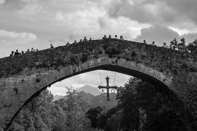 Low angle view of arch bridge against sky