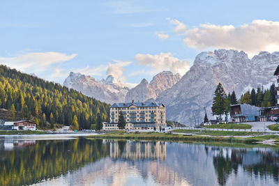 Scenic view of lake and mountains against sky