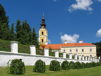 Built structure and trees against sky