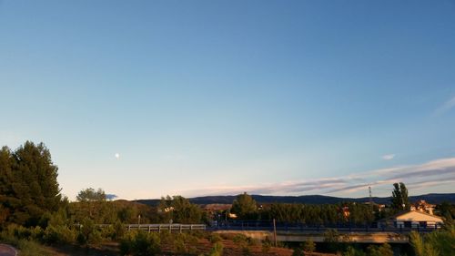 Scenic view of mountains against clear blue sky