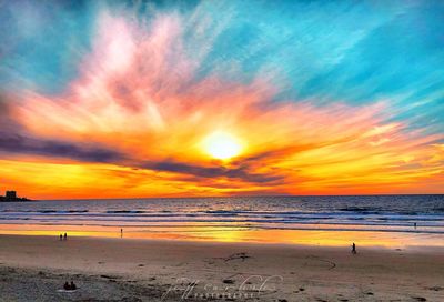 Scenic view of beach against sky during sunset