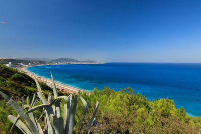 Scenic view of sea against clear blue sky