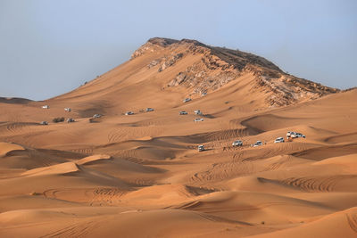 Scenic view of desert against clear sky