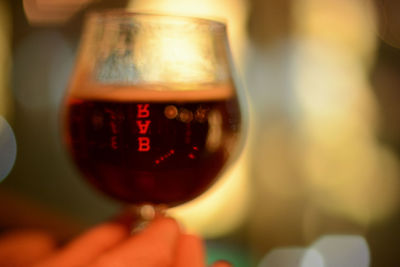 Close-up of hand holding wineglass