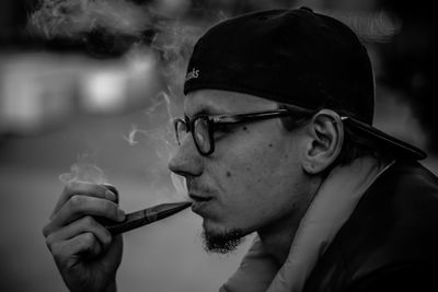 Close up of man smoking cigarette